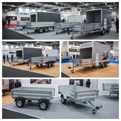 Diverse range of box trailers displayed at an industry expo, clean image, no text, no words, no typography