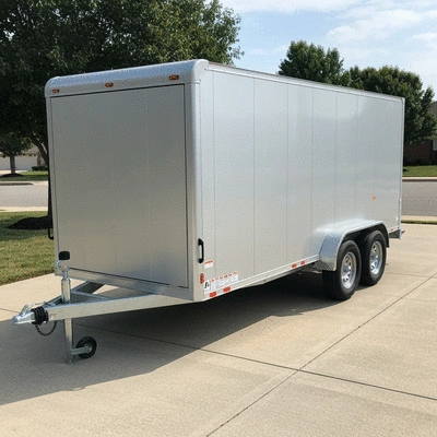 Modern box trailer parked in a driveway, ready for use, no text, no words, no typography, clean image